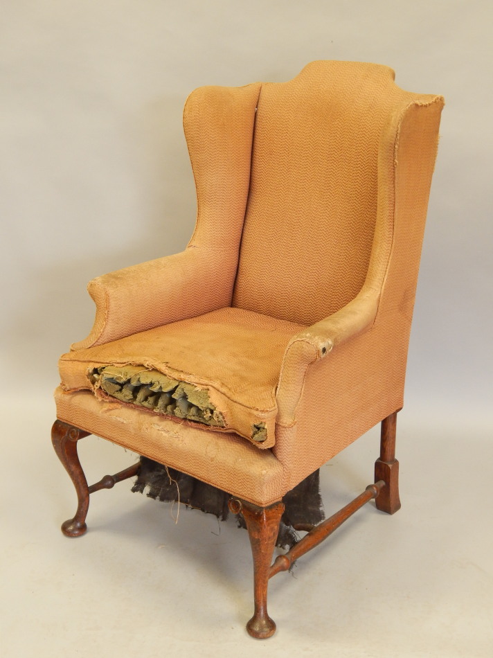 Appraisal: A thC oak wingback chair on cabriole legs with turned