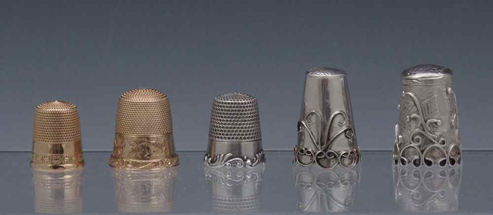 Appraisal: GROUP OF FIVE K GOLD AND STERLING THIMBLES Yellow gold