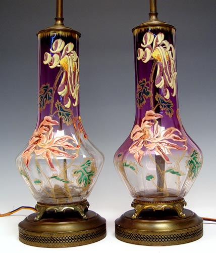 Appraisal: PAIR MONTE JOYE FRENCH ENAMEL GLASS LAMPS Amethyst glass fades