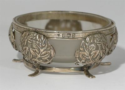 Appraisal: An Artificers Guild silver bowl with glass liner cast in