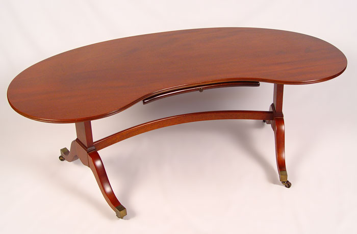 Appraisal: KITTINGER MAHOGANY COFFEE TABLE Kidney shape top on double pedestal