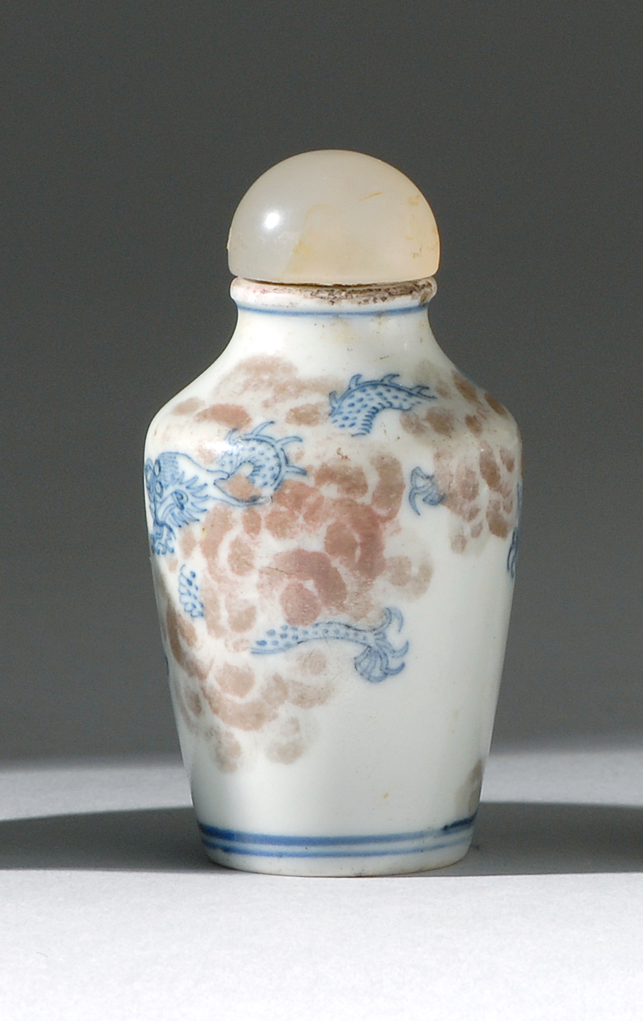 Appraisal: UNDERGLAZE RED AND BLUE PORCELAIN SNUFF BOTTLE th CenturyIn inverted