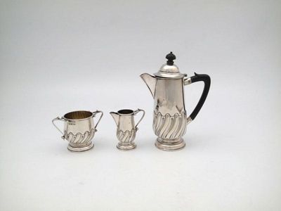 Appraisal: An Edwardian three-piece silver bachelor's coffee set by G Ibbotson