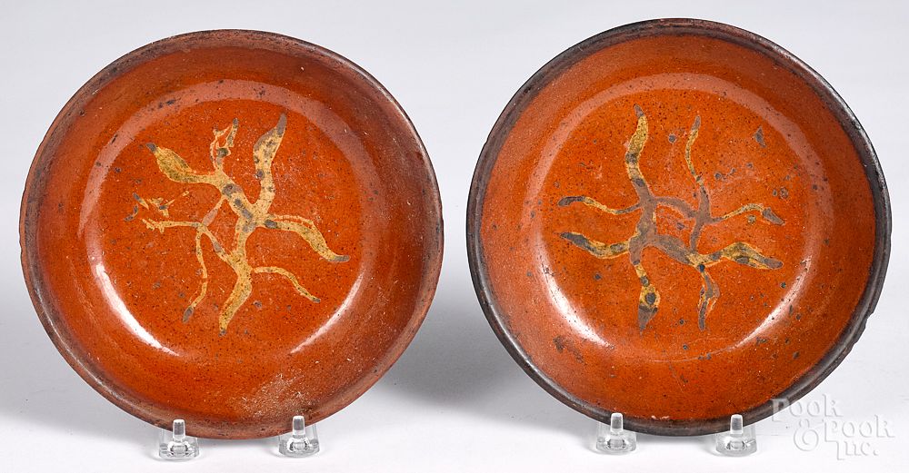 Appraisal: Two Pennsylvania redware shallow bowls th c Two Pennsylvania redware