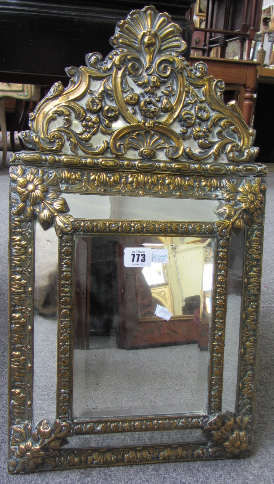 Appraisal: A th century embossed brass marginal wall mirror with arched