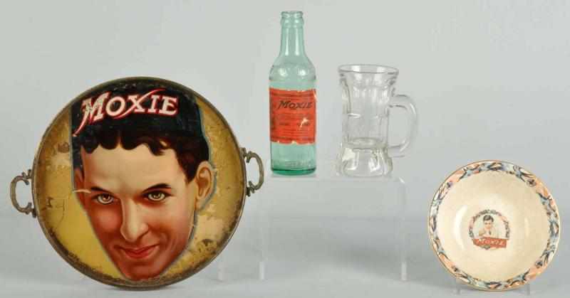 Appraisal: Lot of Assorted Moxie Soda Items Description Includes a heavy