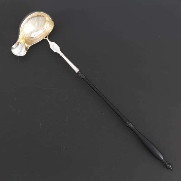 Appraisal: SILVER PUNCH LADLE WITH EBONY AND CARVED HANDLE DATED overall