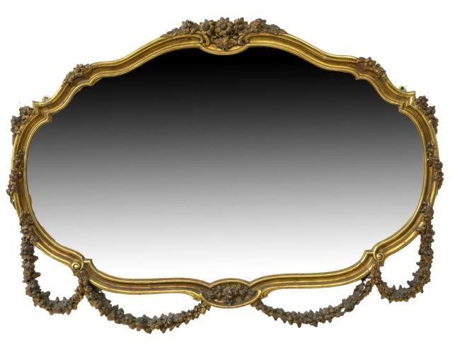 Appraisal: Large Italian giltwood oval mirror th c rocaille frame decorated