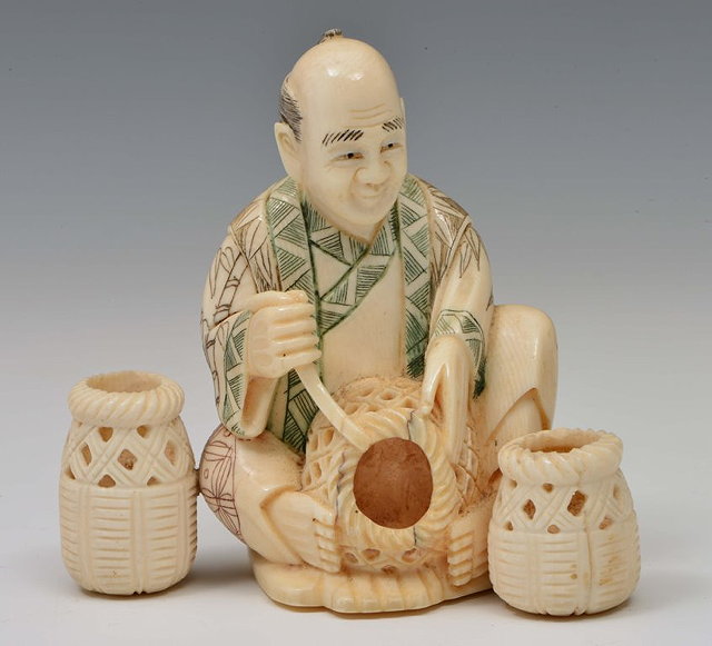 Appraisal: A JAPANESE OKIMONO seated basket maker signed - cm high