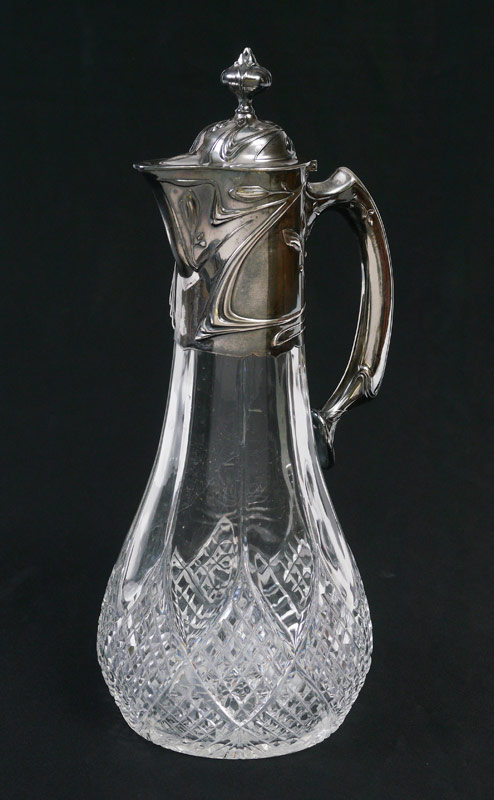 Appraisal: GERMAN FINE SILVER MOUNTED CLARET JUG Art nouveau motif silver