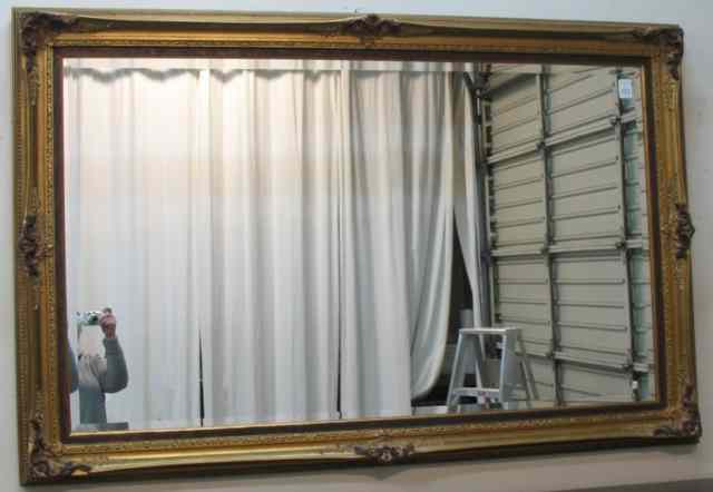 Appraisal: LARGE WALL MIRROR a rectangular beveled glass mirror in th