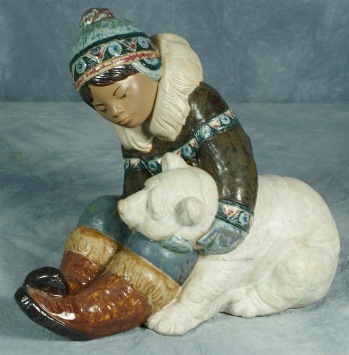 Appraisal: Lladro figurine Eskimo boy with baby bear wide Estimate -