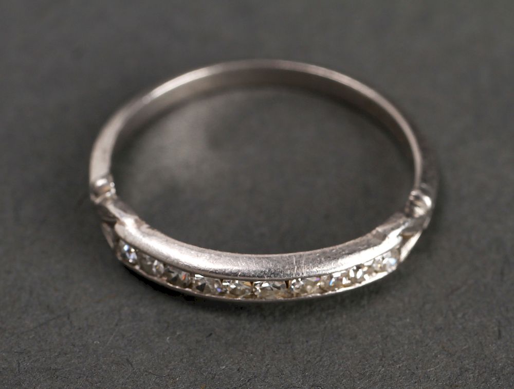 Appraisal: Edwardian Platinum Diamonds Ring Edwardian platinum and channel set round-cut