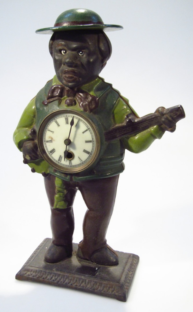 Appraisal: A thC style cast metal figural table clock formed as