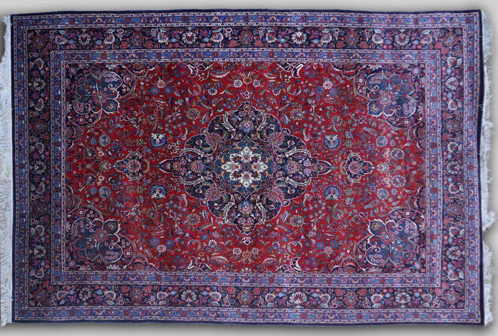 Appraisal: KASHAN HAND KNOTTED WOOL RUG the central radiating floral medallion