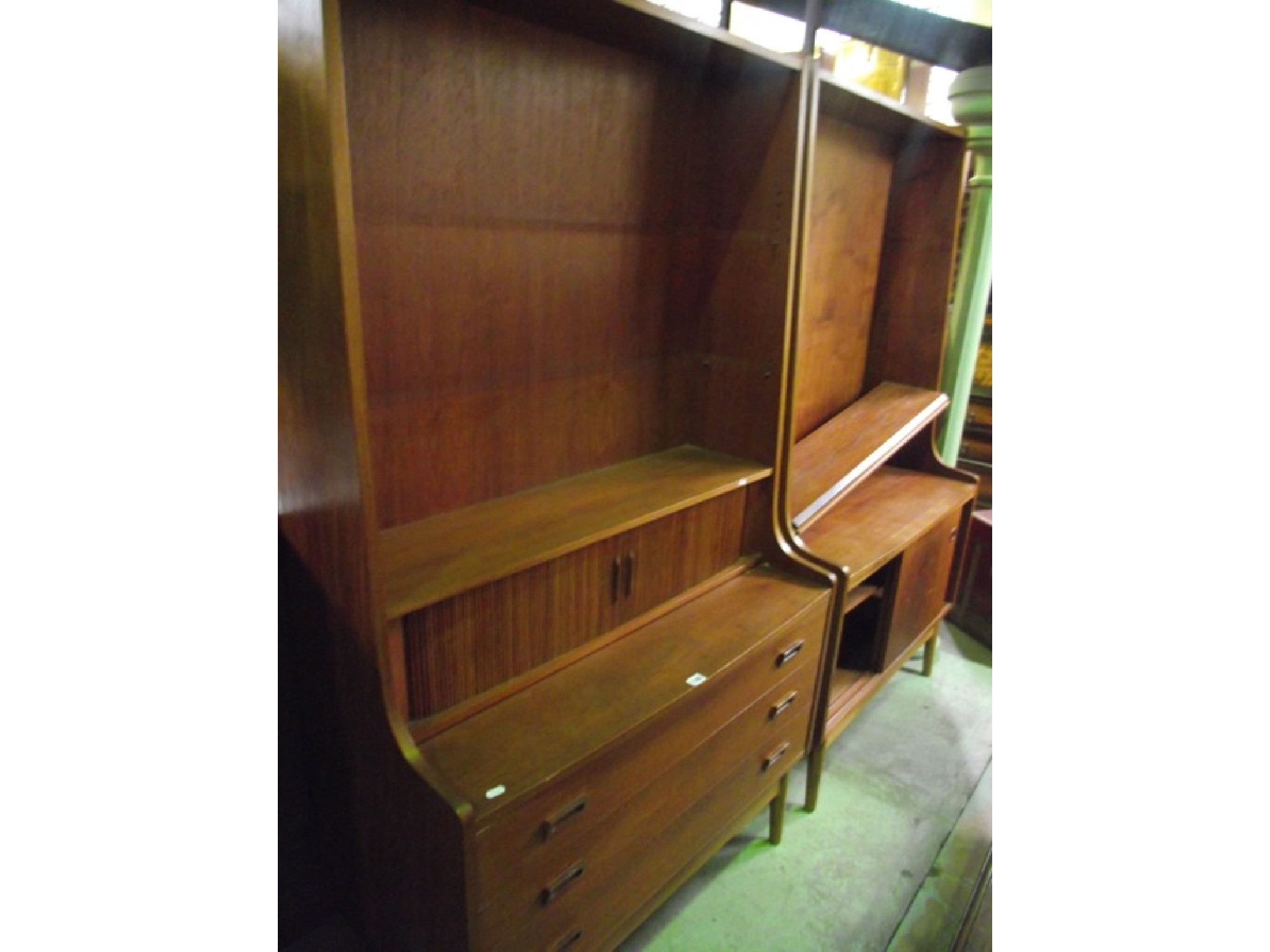 Appraisal: A mid th century teak freestanding side lounge unit with