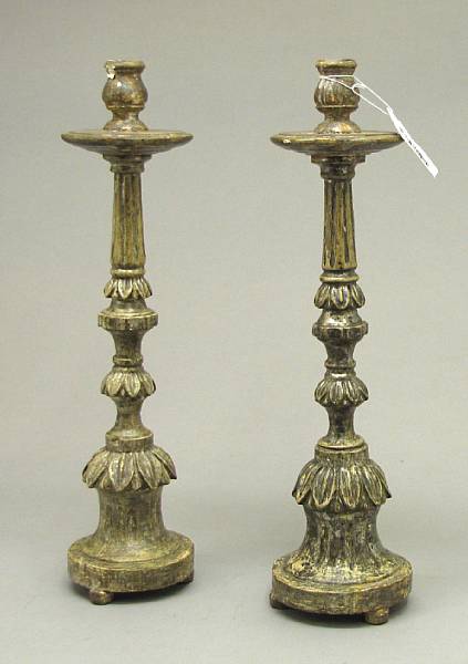 Appraisal: A pair of Portuguese Neoclassical silvered wood candlesticks late th