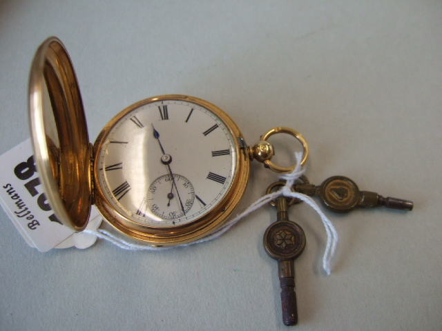 Appraisal: A gold hunting cased fob watch the enameled dial with