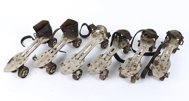 Appraisal: FOUR PAIRS OF STEEL AND LEATHER STRAPPED ROLLER SKATES together