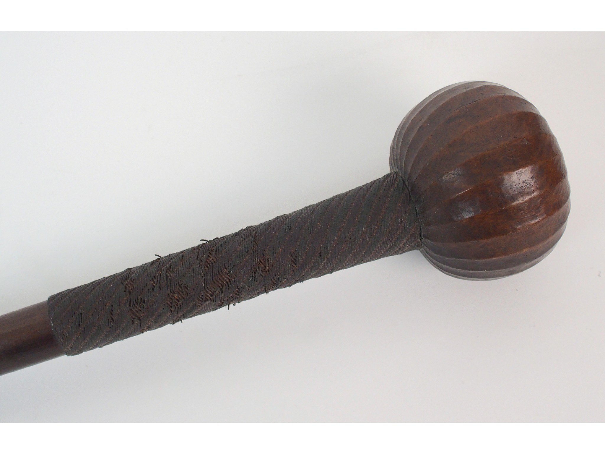 Appraisal: An African hardwood and metal bound knobkerrie cm long