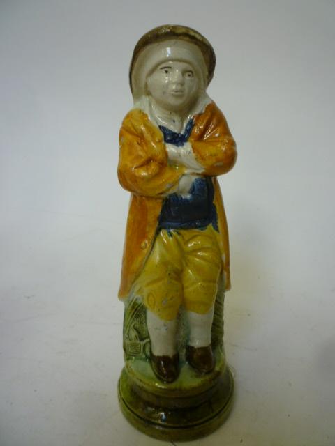 Appraisal: A PRATTWARE MALE FIGURE late th century modelled as Winter