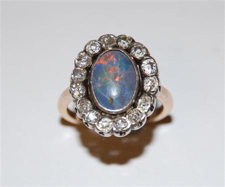 Appraisal: An ct gold mounted black opal and diamond cluster ring