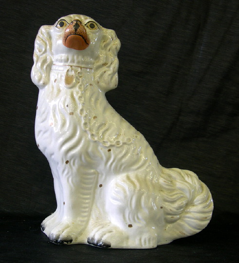 Appraisal: Staffordshire Pottery Figure depicting a seated collared white spaniel third