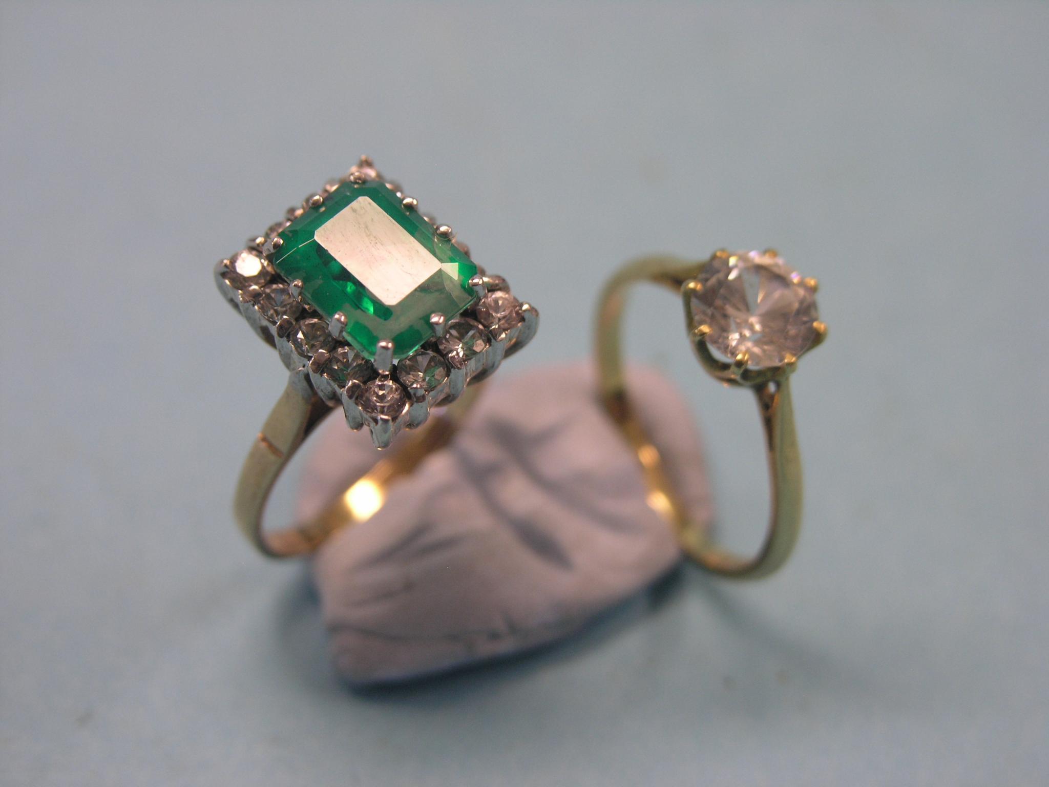 Appraisal: An ct gold emerald and diamond ring step-cut emerald surrounded