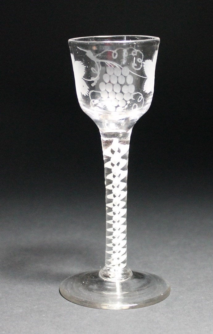 Appraisal: An opaque twist wine glass circa the ogee bowl engraved