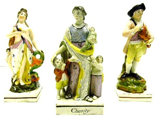 Appraisal: Staffordshire three figures ''Charity'' mother with three young children paint