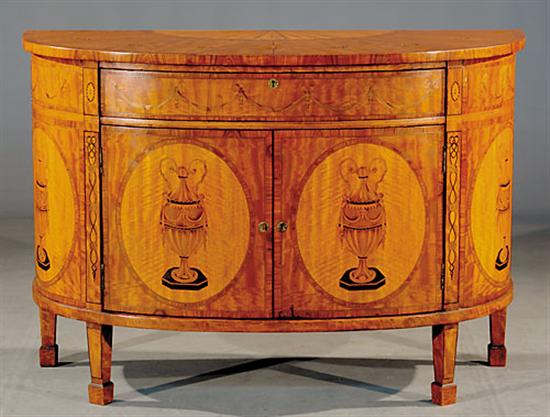 Appraisal: Edwardian inlaid satinwood bow front commode circa elliptical top with