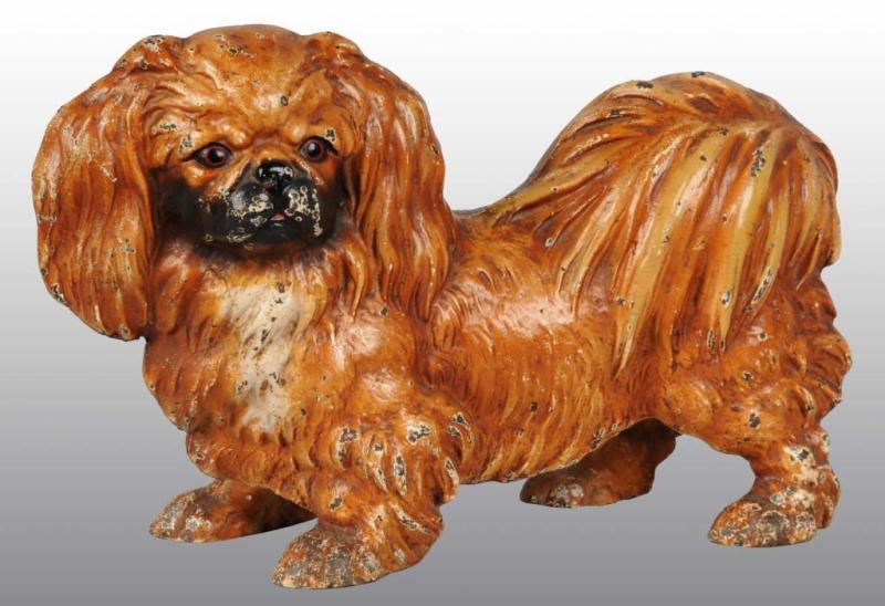 Appraisal: Cast Iron Pekingese Doorstop Description Made by Hubley cat Full-figure