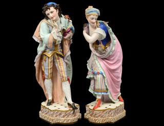 Appraisal: PAIR OF CONTINENTAL BISQUE FIGURES European Depicting a man and