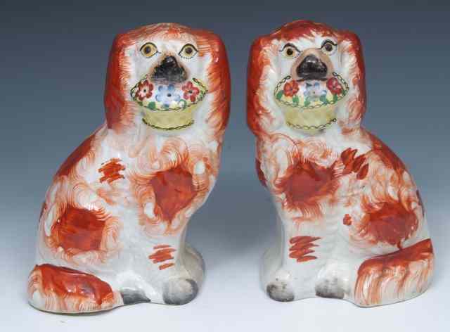 Appraisal: A PAIR OF TH CENTURY STAFFORDSHIRE KING CHARLES SPANIELS each