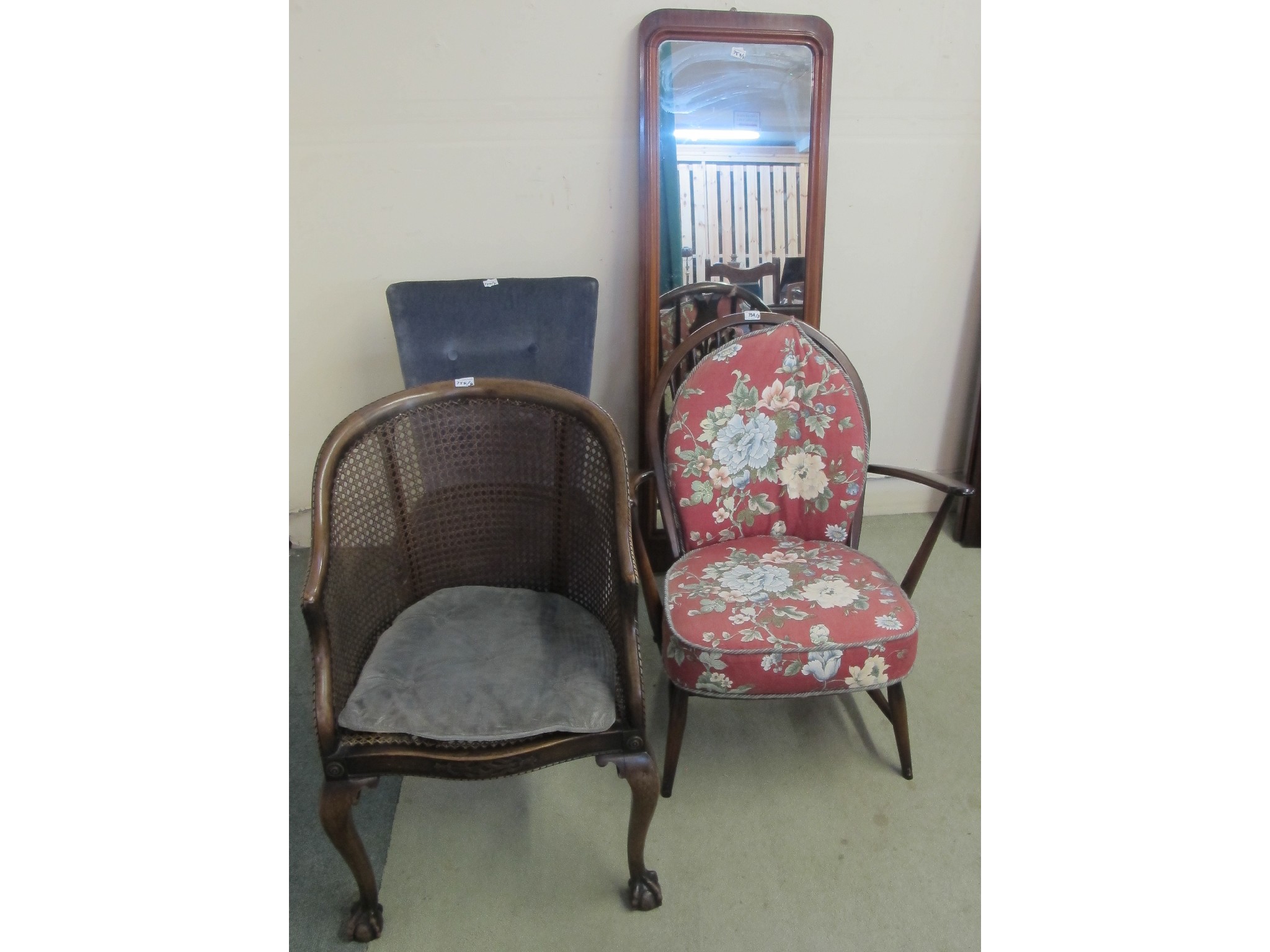 Appraisal: Ercol chair and cushions Bergere chair blue button back chair