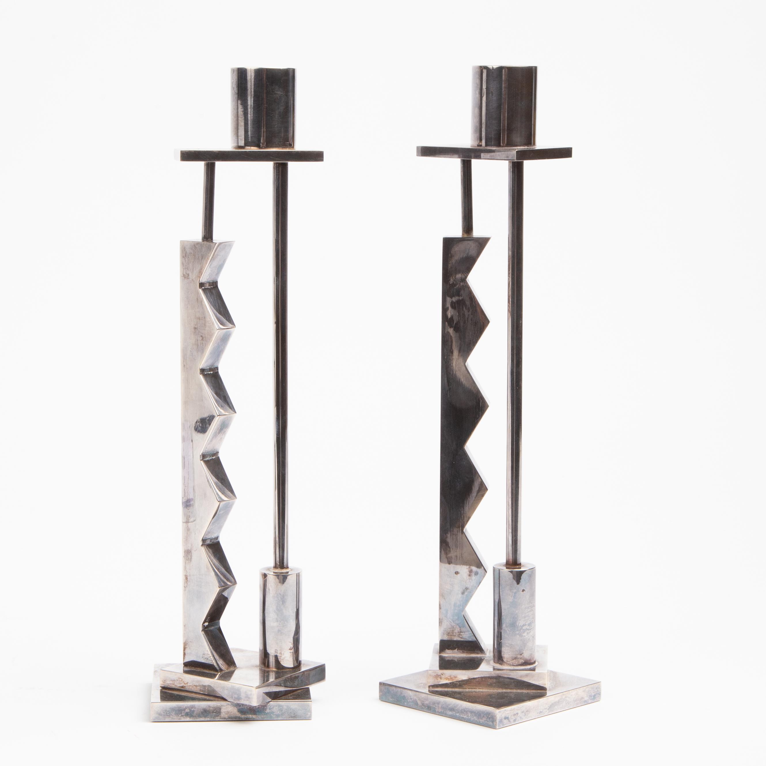 Appraisal: ETTORE SOTTSASS FOR SWID POWELL CANDLESTICKS Pair of weighted candlesticks