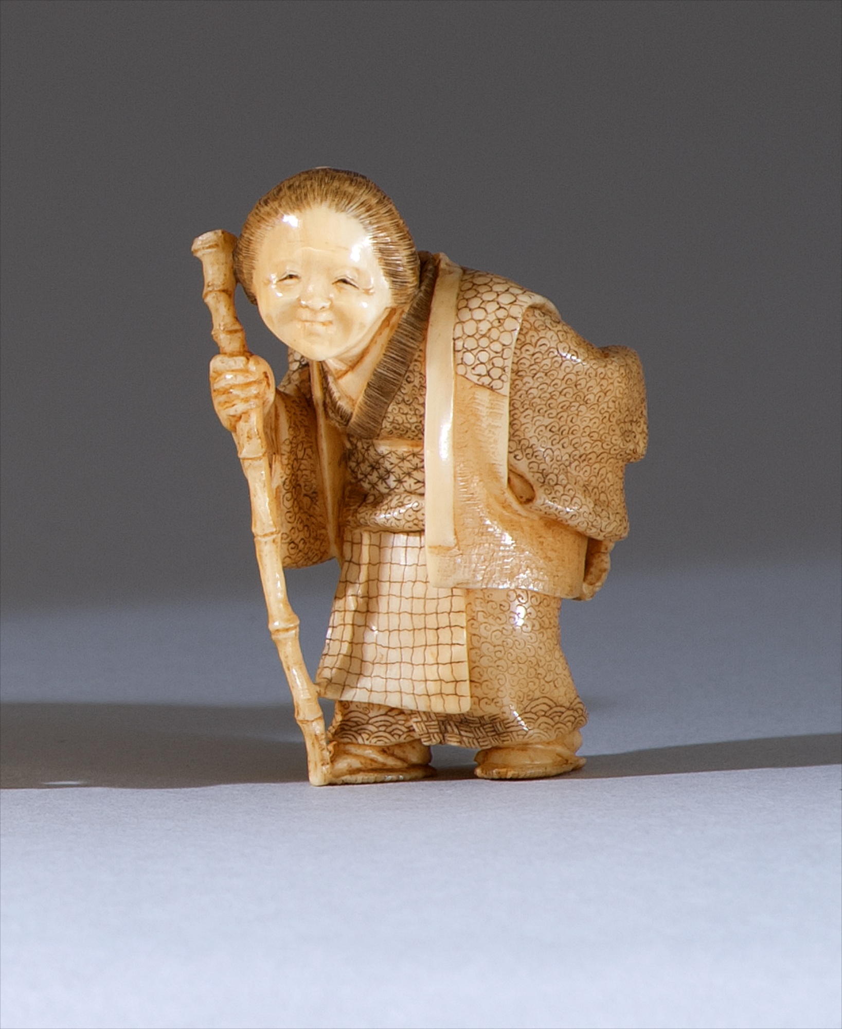 Appraisal: IVORY NETSUKE Meiji PeriodBy Hogetsu In the form of an