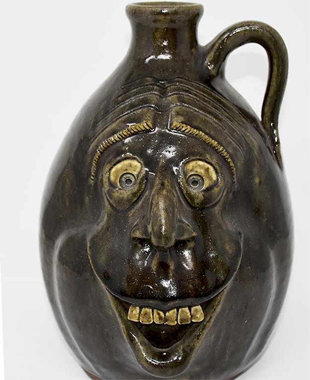 Appraisal: Melvin Crocker Grotesque face jug Grotesque face jug signed Melvin