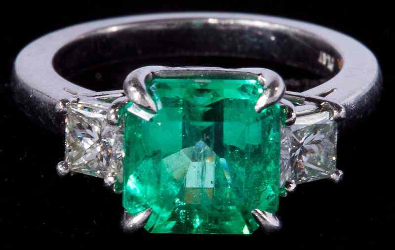 Appraisal: Platinum Emerald and Diamond Ringcentering on one square cut emerald