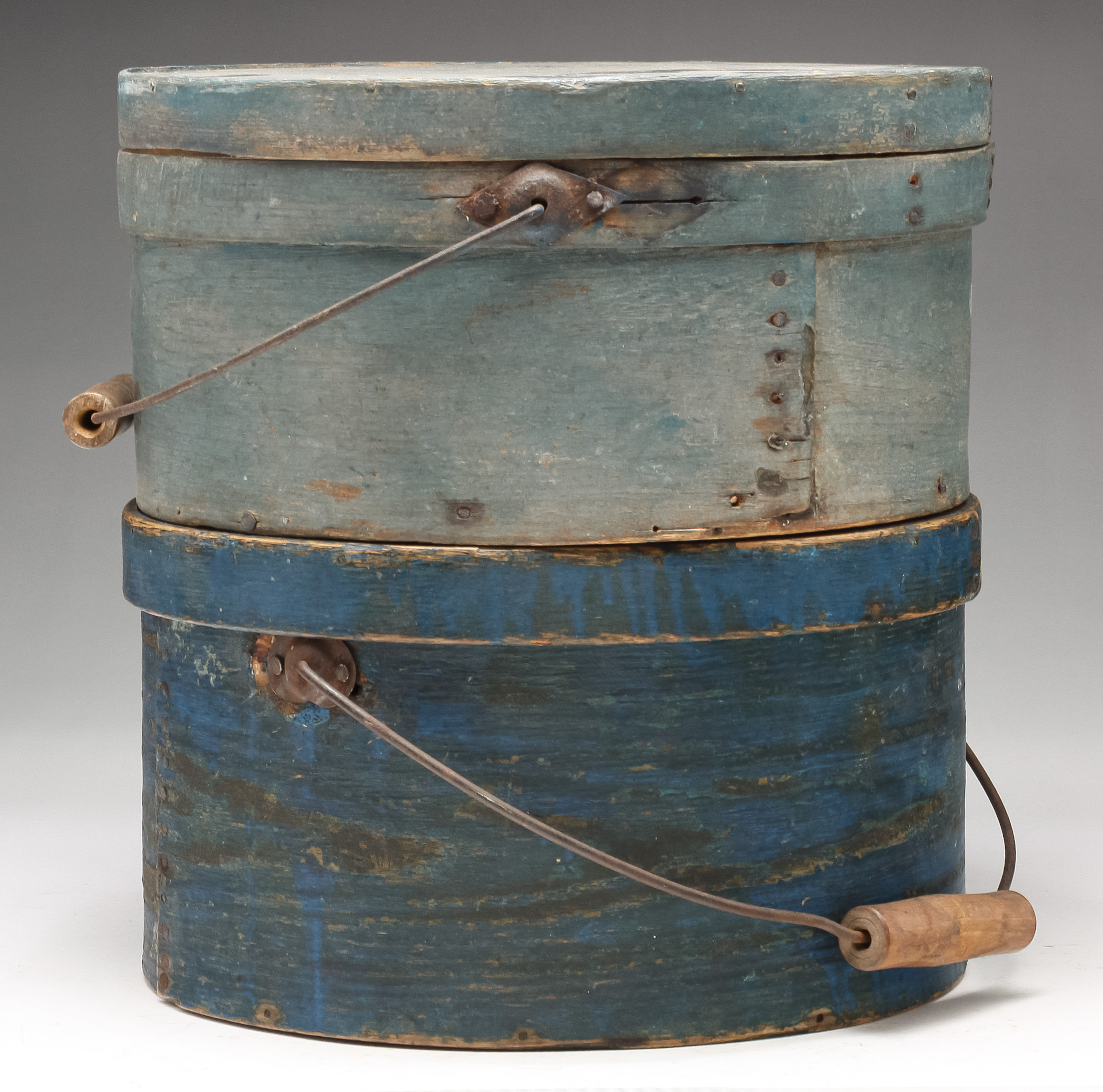 Appraisal: TWO AMERICAN CARRIERS Second half th century Round bentwood carriers