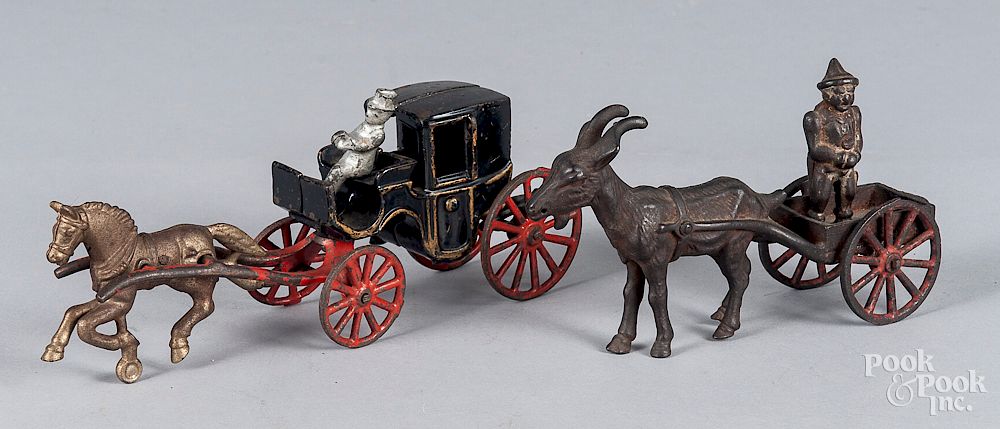 Appraisal: Two cast iron animal drawn wagons Two cast iron animal