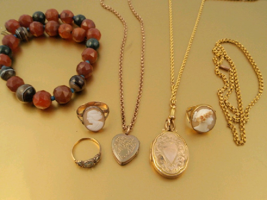 Appraisal: A short carnelian and agate bead necklace two lockets two