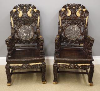 Appraisal: Pr Chinese Throne chairs A pair of Chinese carved hardwood