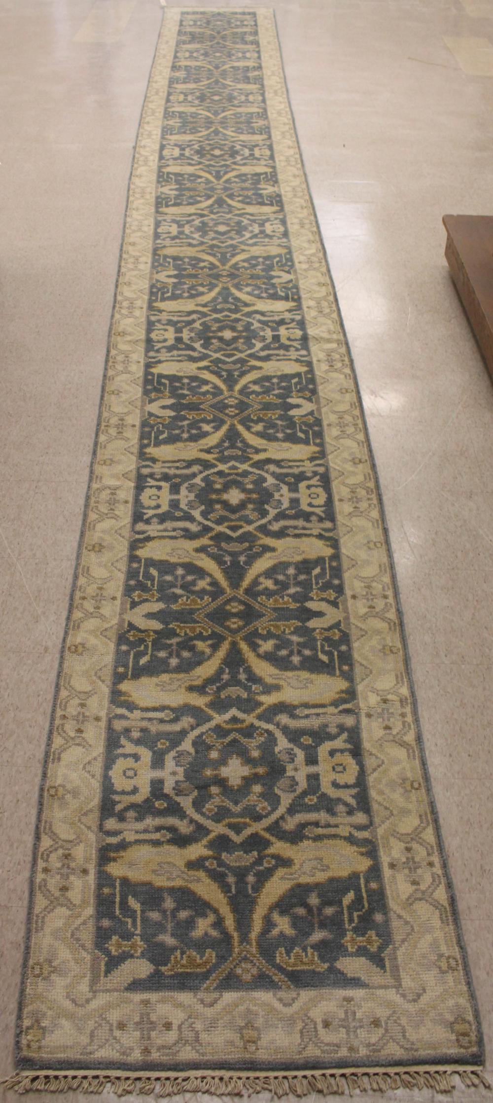 Appraisal: HAND KNOTTED ORIENTAL LONG RUG Indo-Persian stylized floral and curvilinear