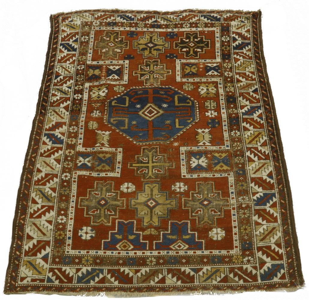 Appraisal: KARACHOPH KAZAK RUG Large octagonal navy blue medallion surrounded by