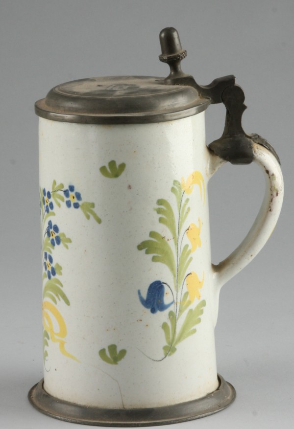 Appraisal: Tankard features overall floral motif t hairline S