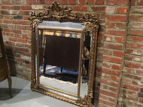 Appraisal: CONTINENTAL STYLE BEVELED MIRROR th c gold painted beveled mirror