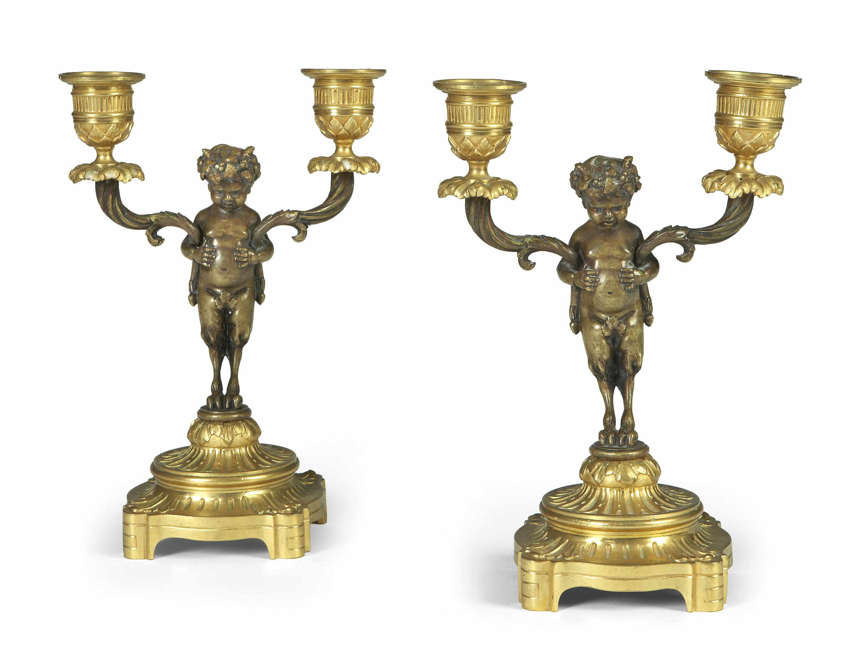 Appraisal: A pair of French gilt and patinated bronze figural two