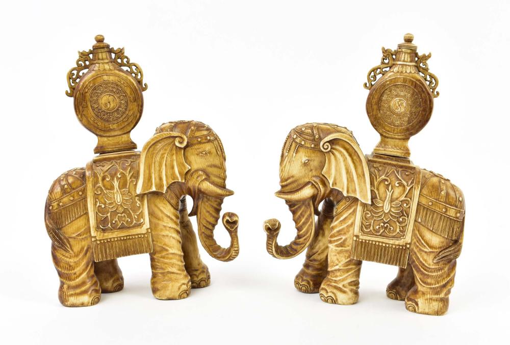 Appraisal: PAIR OF CHINESE STAINED ELEPHANTS SUPPORTING SNUFF BOTTLESEach dressed with