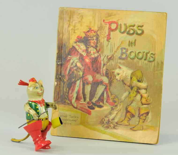 Appraisal: PUSS IN BOOTS TOY BOOK Includes tin lithographed walking toy